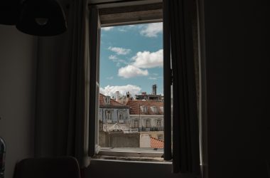 mandatory remote worker looks out of Portugal window