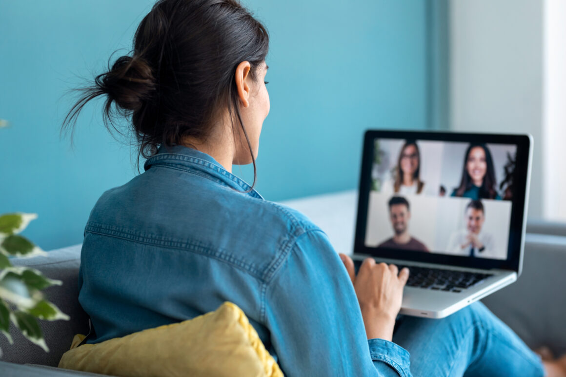 Woman conducting a remote team meeting
